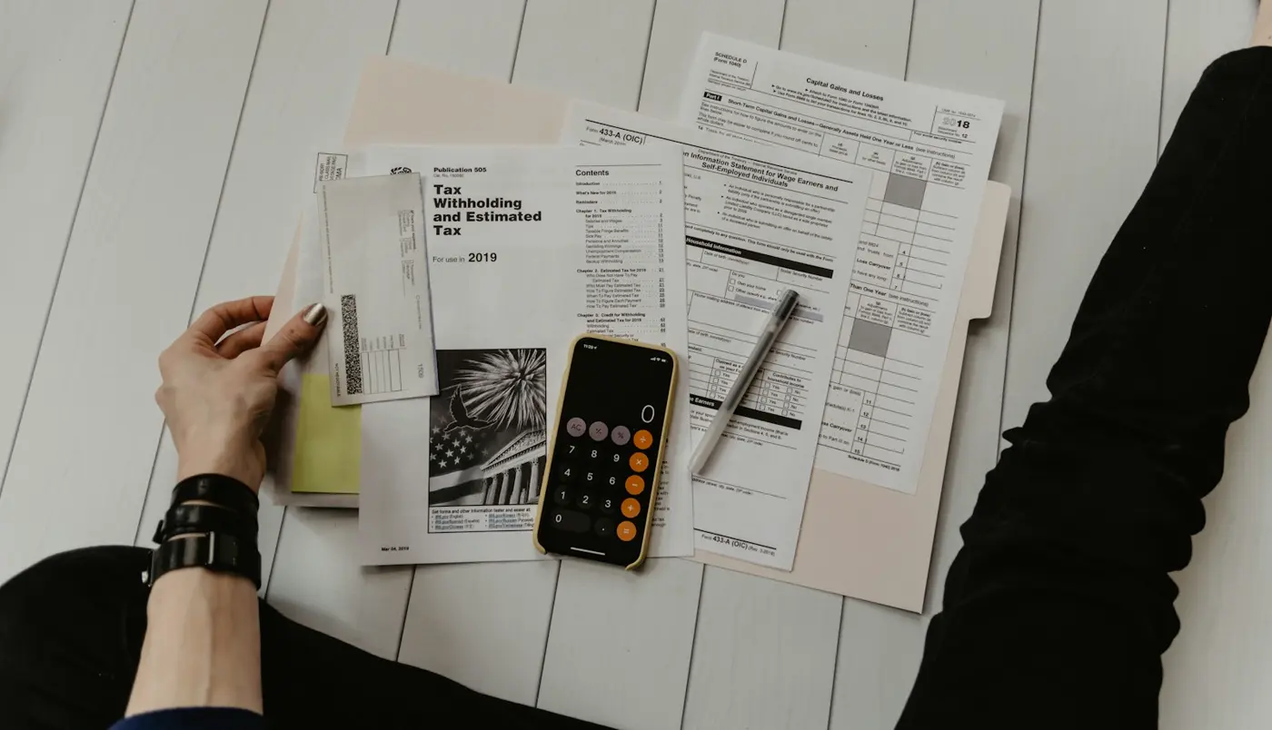 Calculator and finance documents on a desk